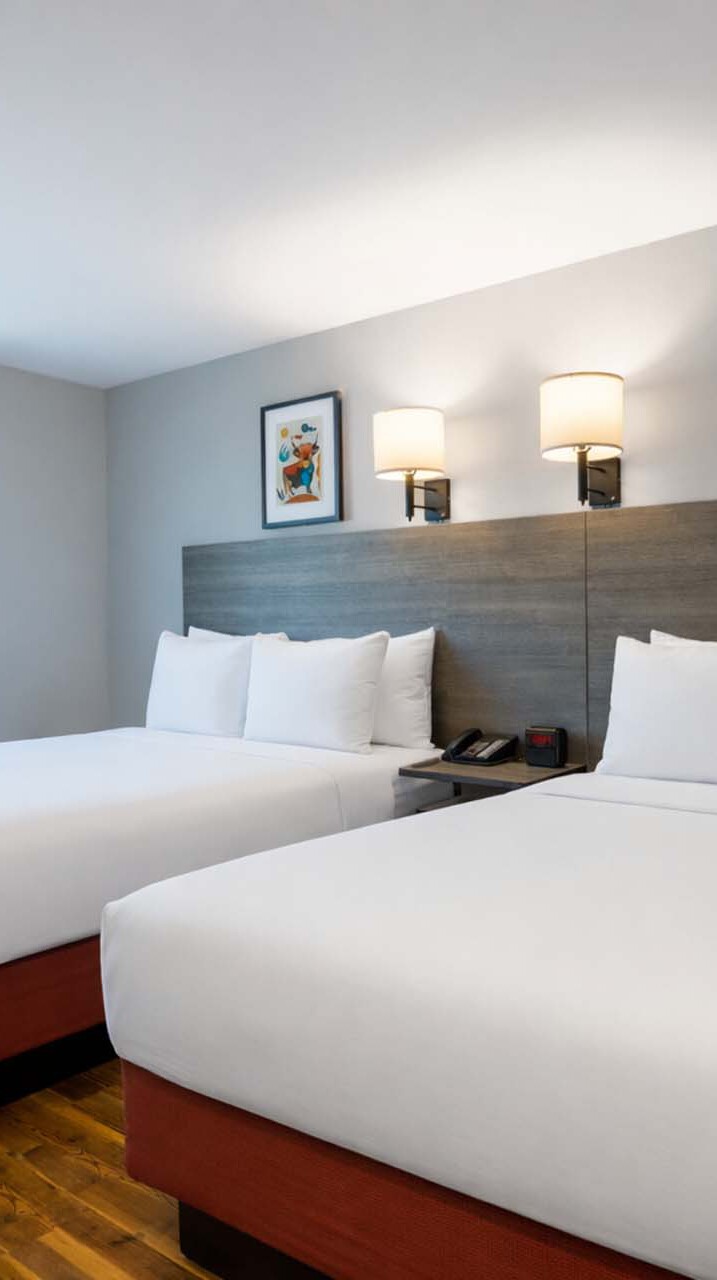 Two queen beds in a guest room