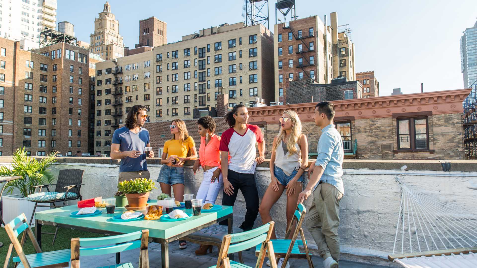 A group of friends hanging out on a rooftop