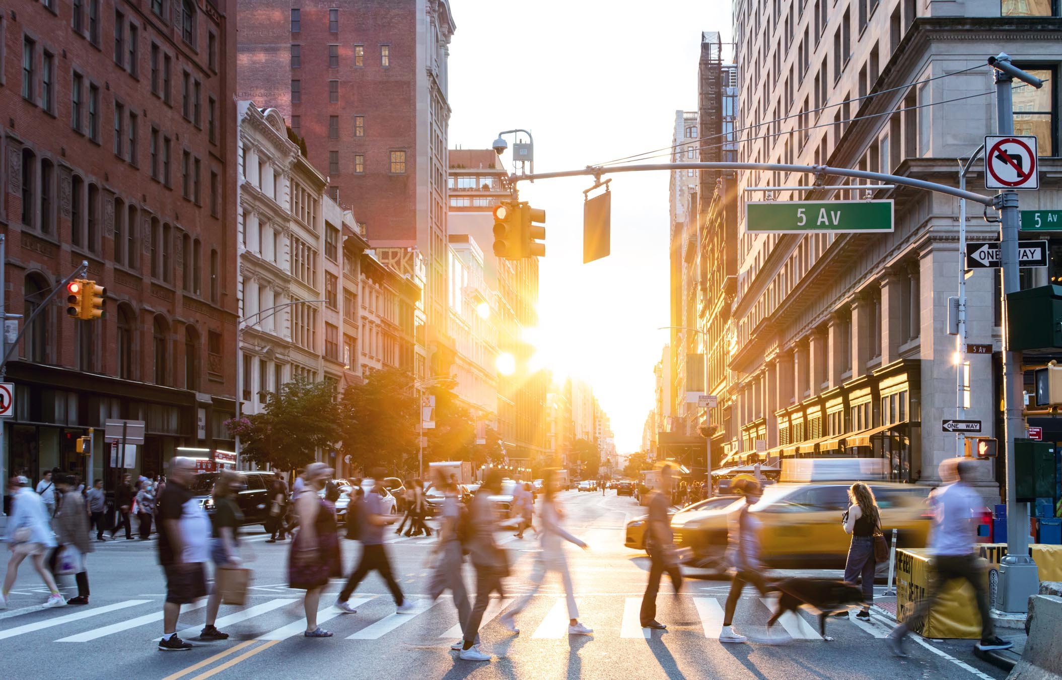 People crossing busy street